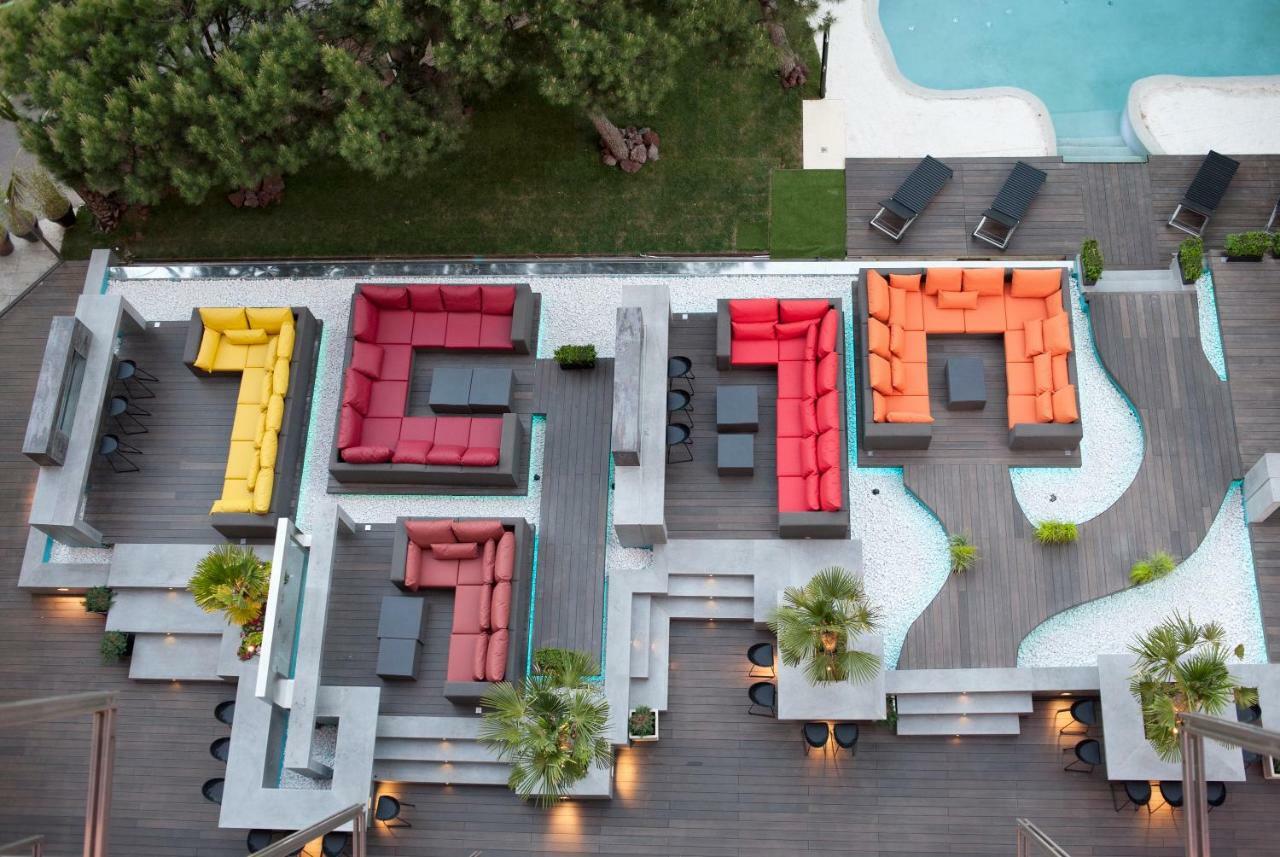 Hotel Puerta America Madrid Exterior photo The pool deck of a modern villa